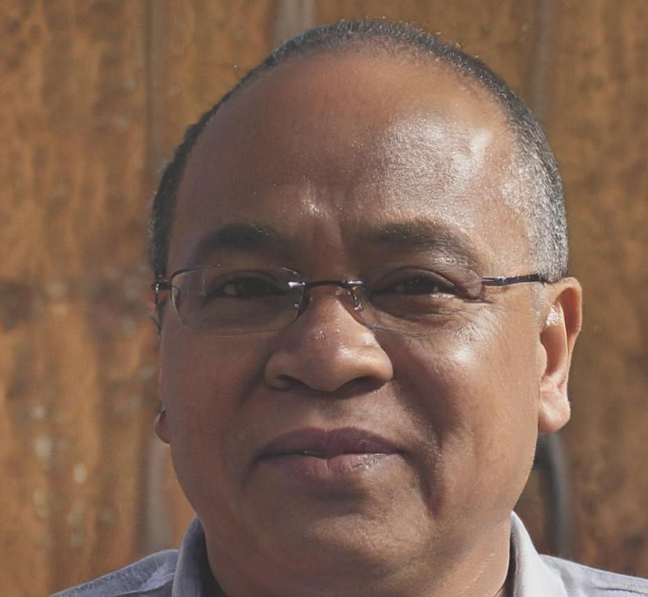 Professional headshot of financial analysis expert